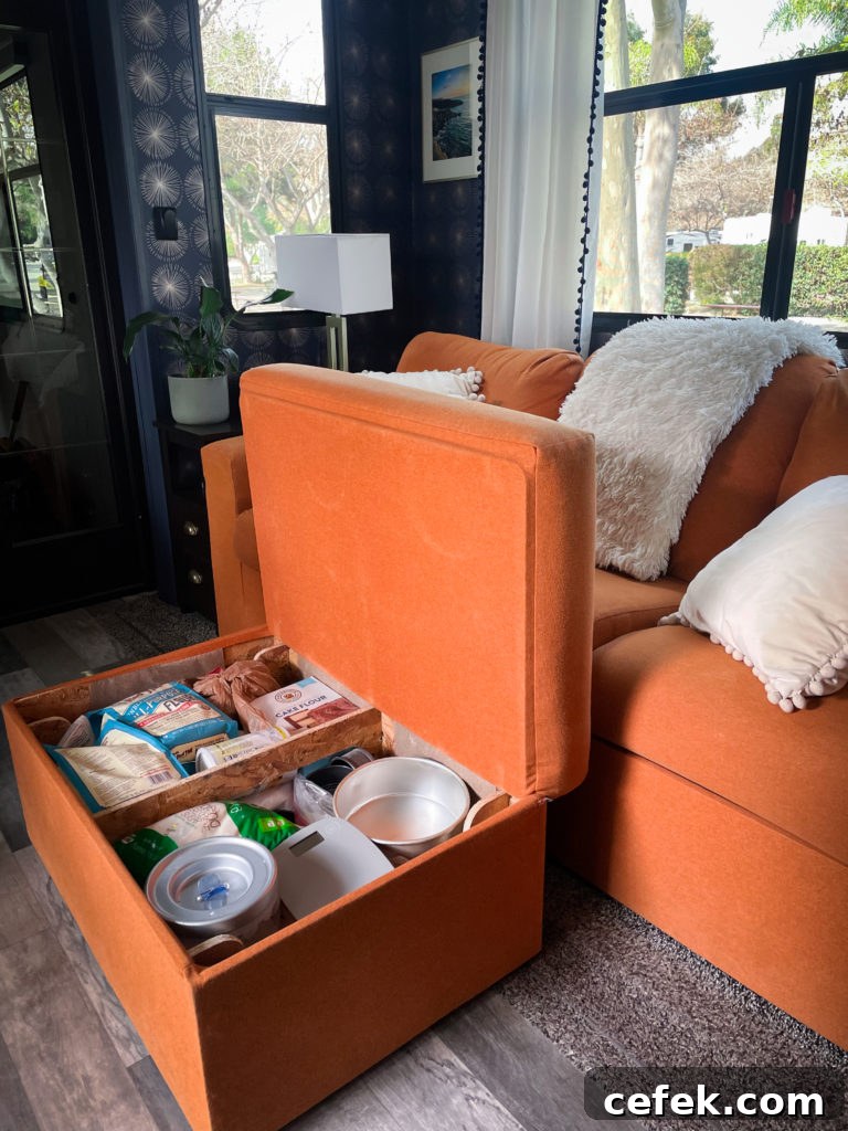 Our ottoman with the top lifted up so you can see the storage space inside.