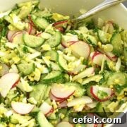 Cucumber Radish Salad is fresh, creamy and crunchy. The combo of fresh cucumbers, radishes and boiled eggs not only bring a crunchy texture, but also a beautiful vibrant color to this salad. | olgainthekitchen.com