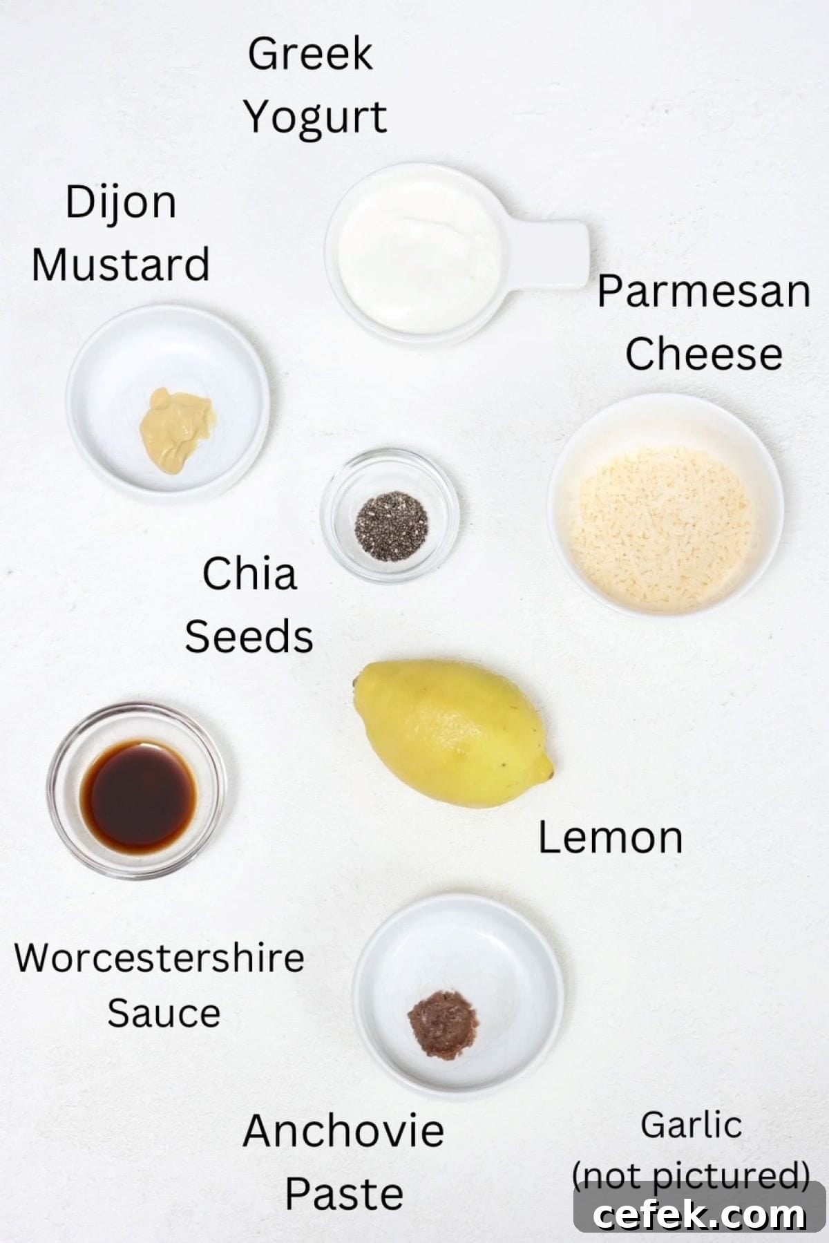 Ingredients for making homemade Caesar dressing, labeled.