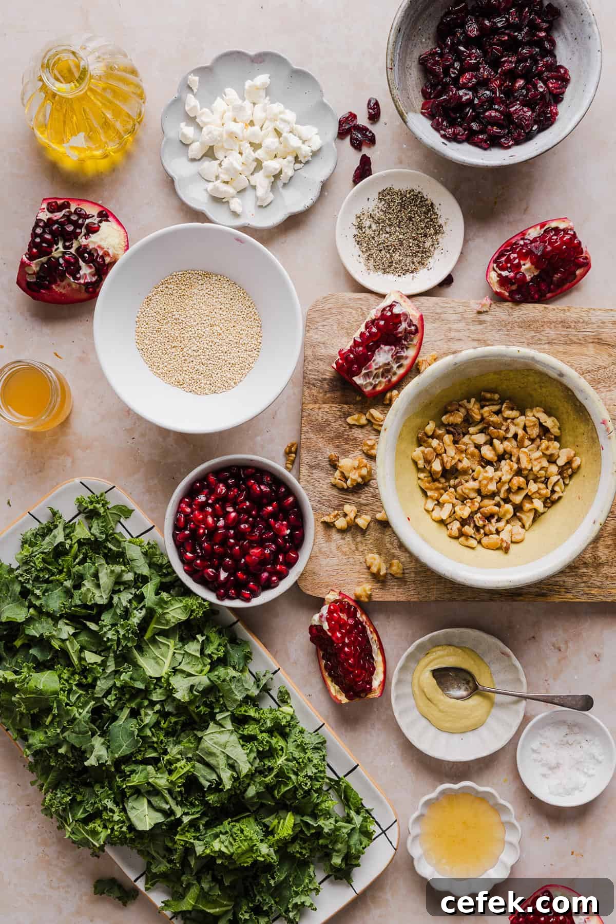This Winter Kale and Quinoa Salad is a vibrant, wholesome salad that is bursting with flavor! Made with leafy kale, tender quinoa, juicy pomegranate seeds and crunchy walnuts all tossed together with a light dijon vinaigrette for the perfect holiday side dish!