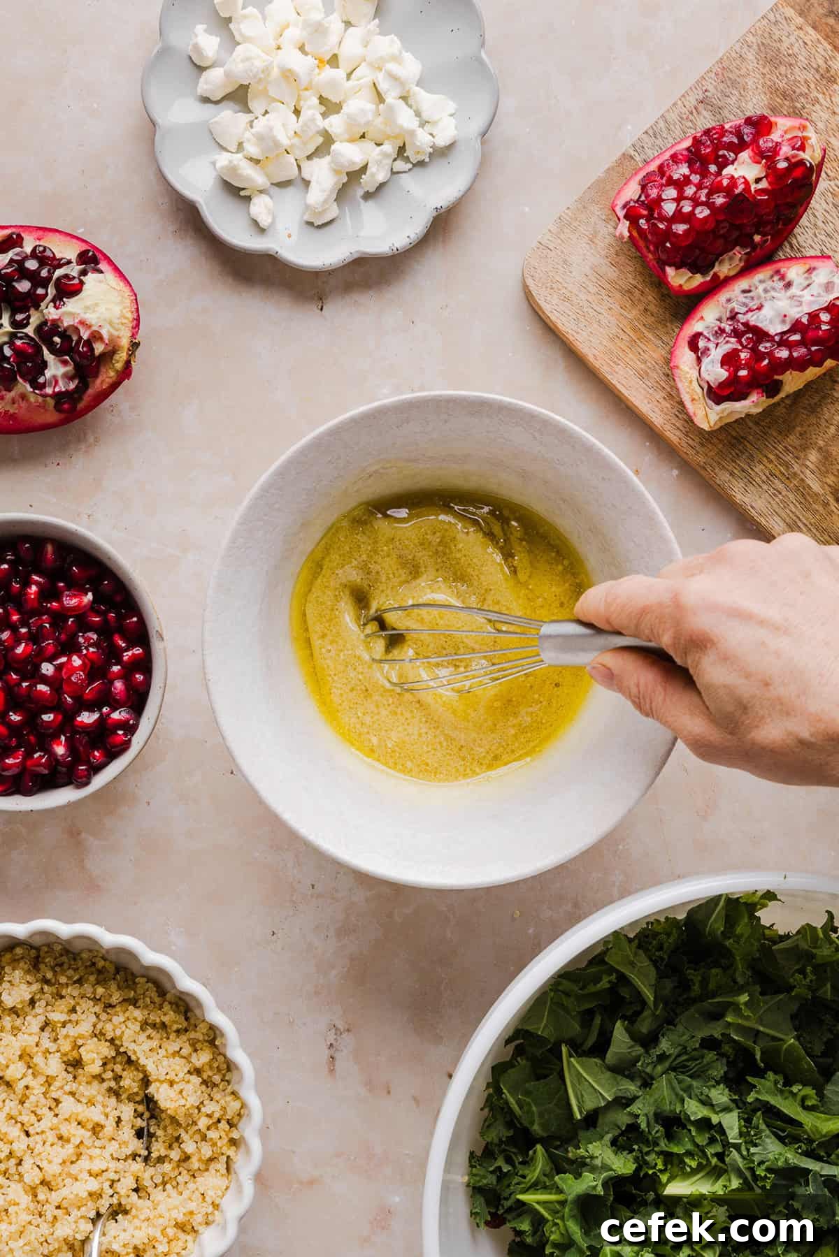 This Winter Kale and Quinoa Salad is a vibrant, wholesome salad that is bursting with flavor! Made with leafy kale, tender quinoa, juicy pomegranate seeds and crunchy walnuts all tossed together with a light dijon vinaigrette for the perfect holiday side dish!