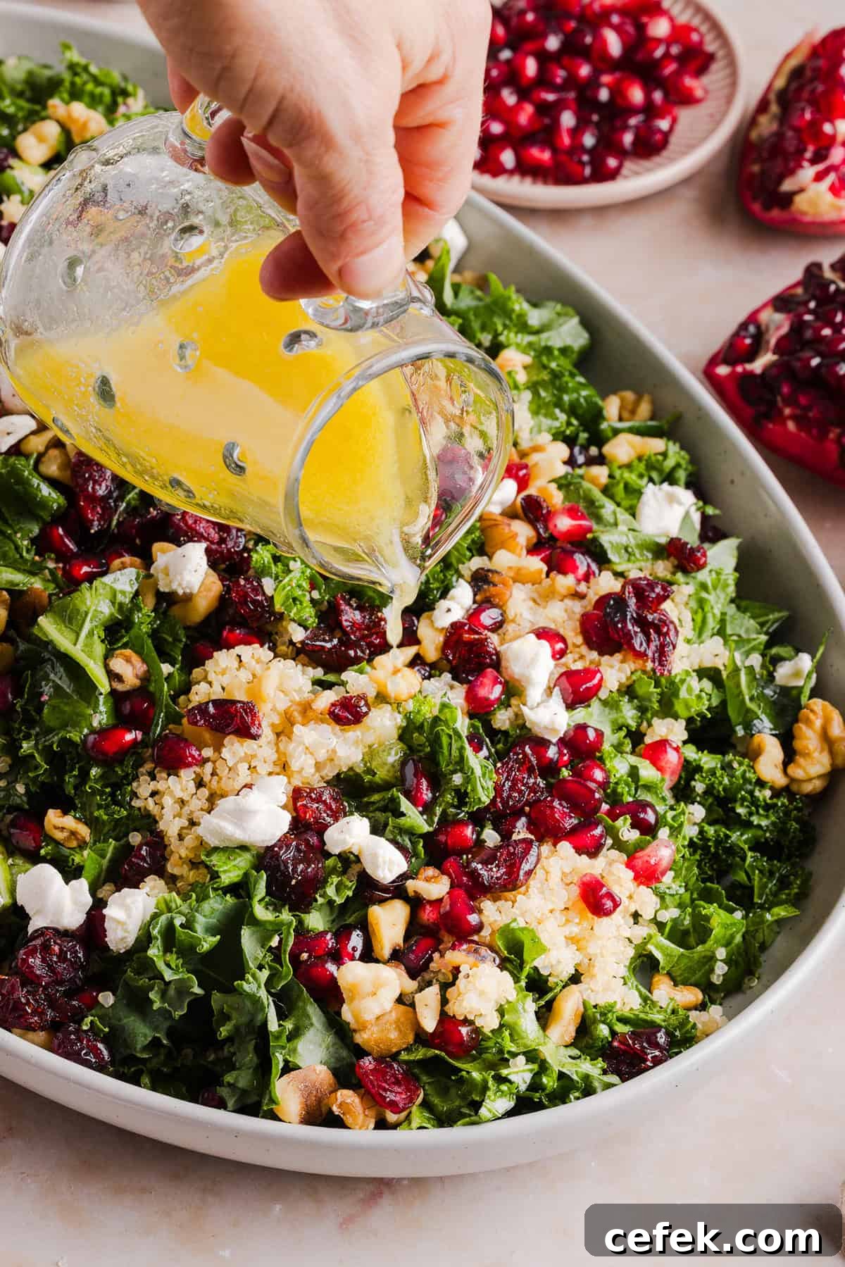 This Winter Kale and Quinoa Salad is a vibrant, wholesome salad that is bursting with flavor! Made with leafy kale, tender quinoa, juicy pomegranate seeds and crunchy walnuts all tossed together with a light dijon vinaigrette for the perfect holiday side dish!