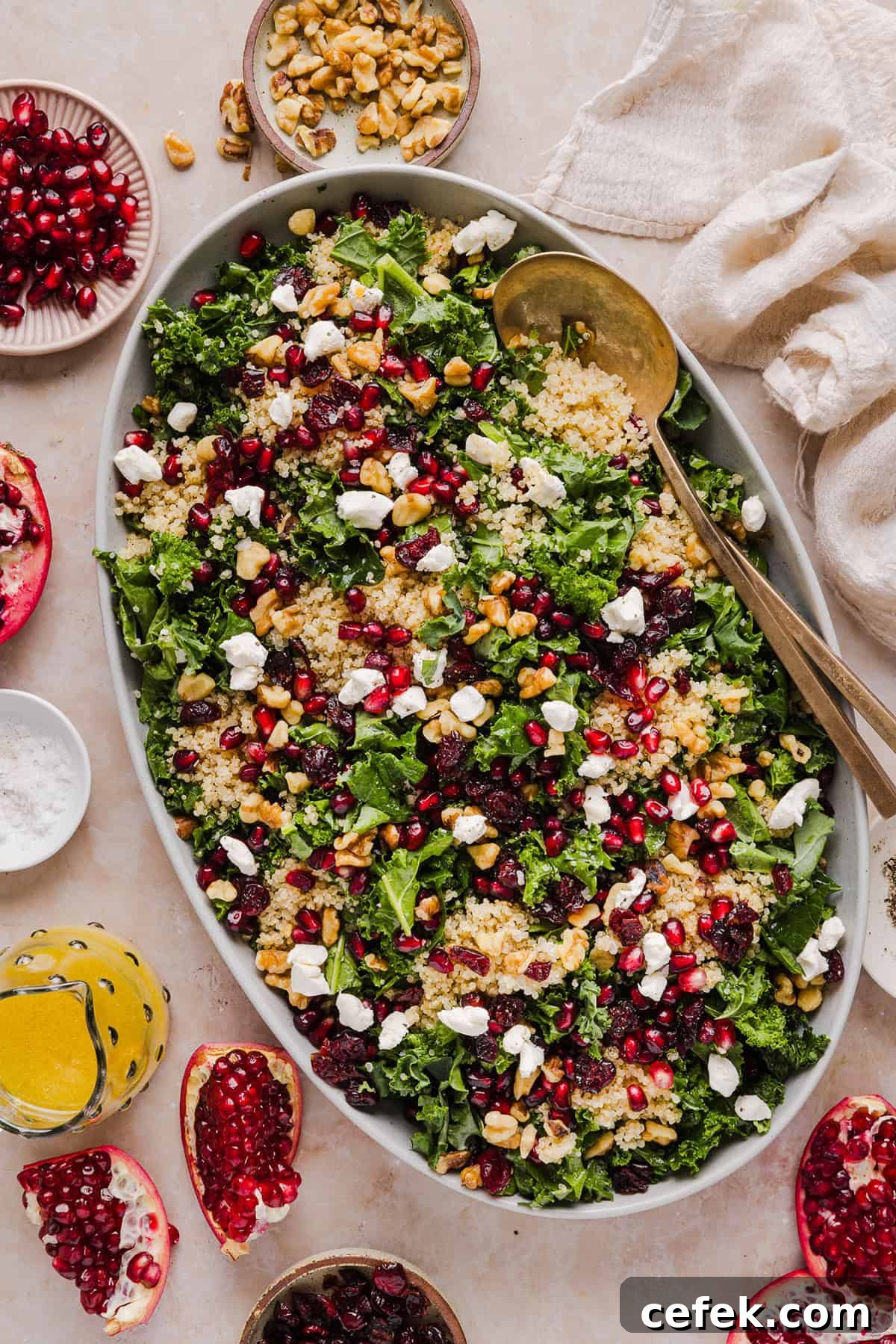 This Winter Kale and Quinoa Salad is a vibrant, wholesome salad that is bursting with flavor! Made with leafy kale, tender quinoa, juicy pomegranate seeds and crunchy walnuts all tossed together with a light dijon vinaigrette for the perfect holiday side dish!