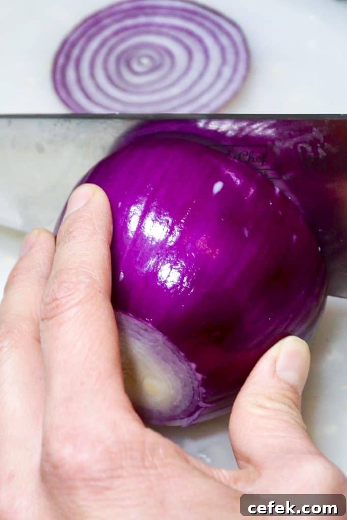 Slicing a red onion for homemade cough syrup