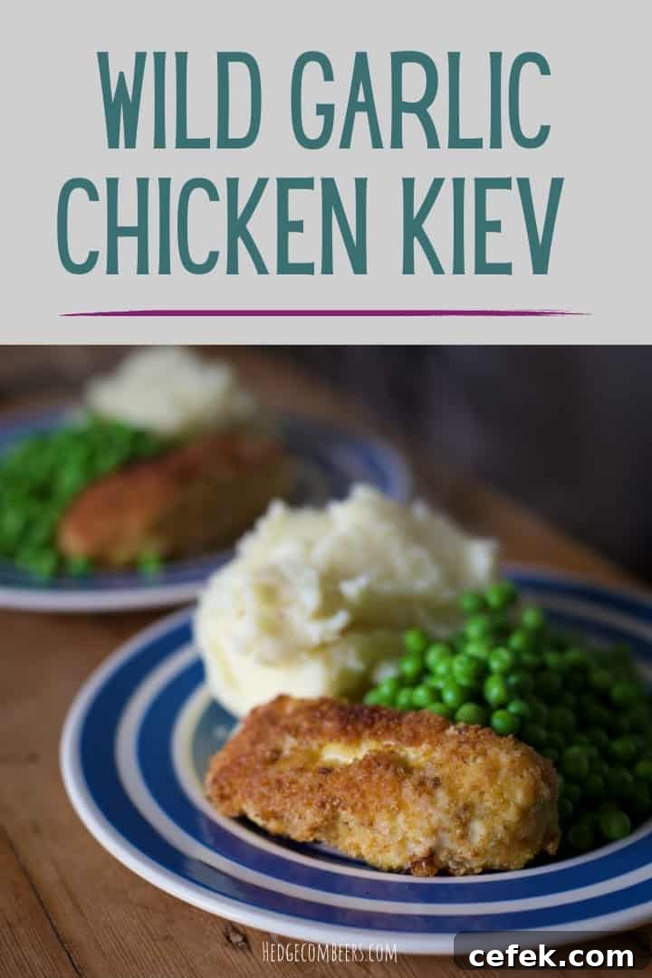 Blue and white plate with homemade wild garlic stuffed chicken Kiev, mashed potato and green peas