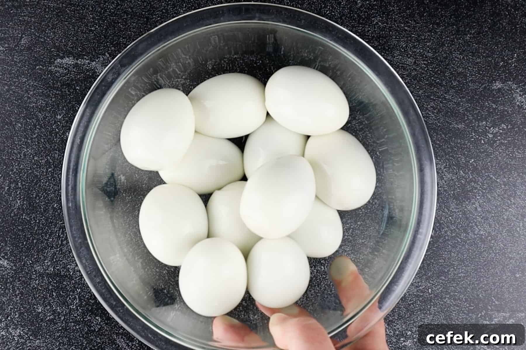 hard-boiled eggs in a glass bowl.
