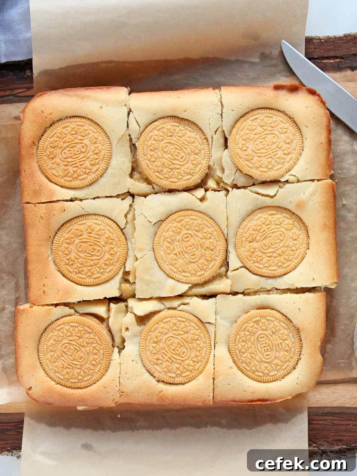 Oreo Blondies cut in squares on parchment paper