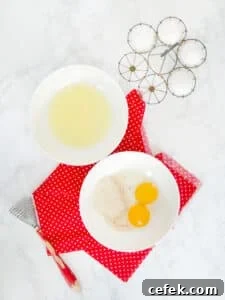 Matzo meal pancake process shot showing eggs separated in two bowls.