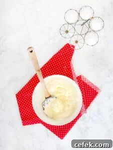 Matzo meal pancake process shot showing whites and yellow matzo meal mixture combined.