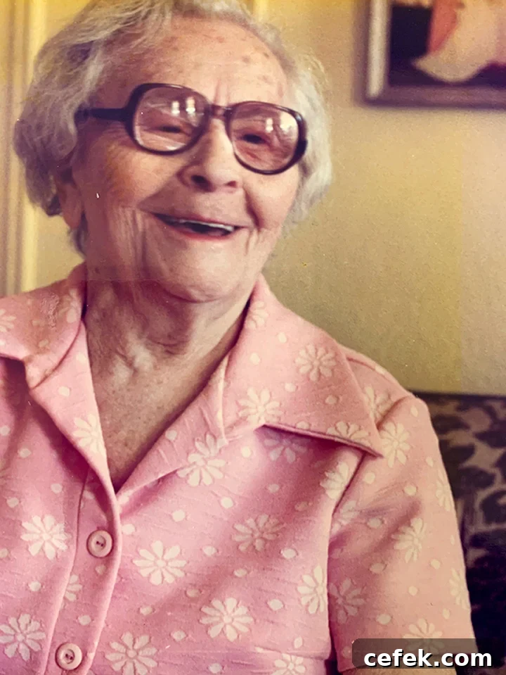 Grandma Annie smiling in a pink dress