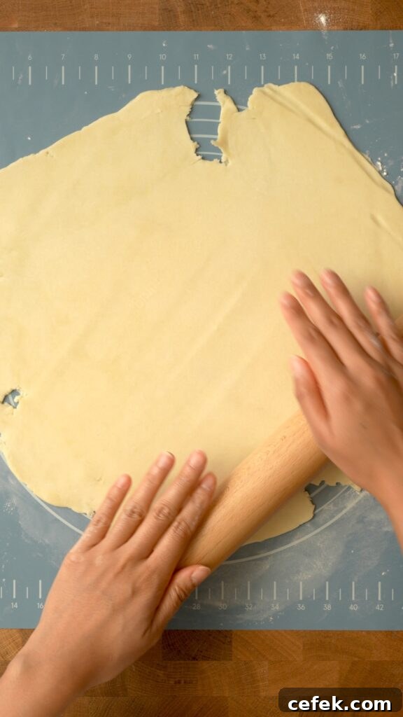 Rolling out the dough very thinly