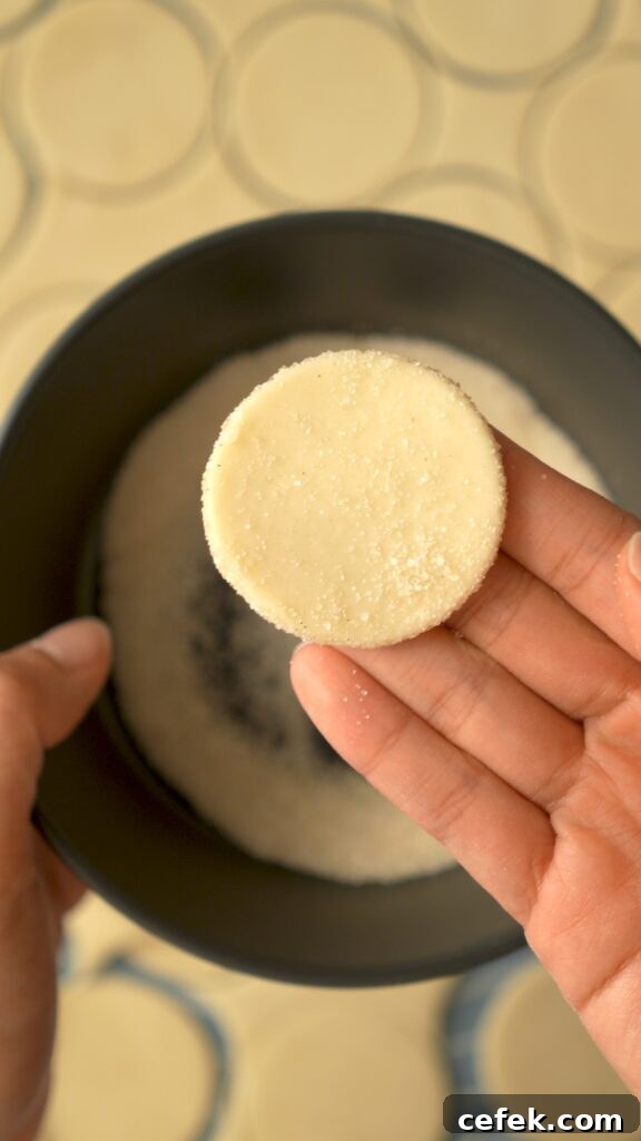 dredging a dough circle in vanilla sugar