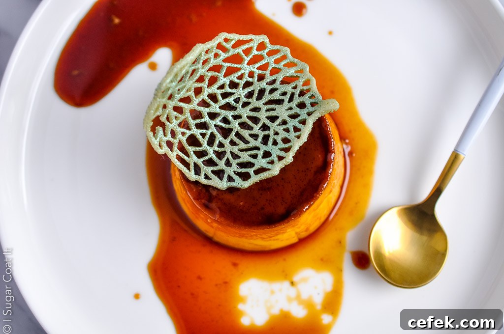 top view of creme caramel in a puddle of caramel topped with lace tuile accent | i sugar coat it