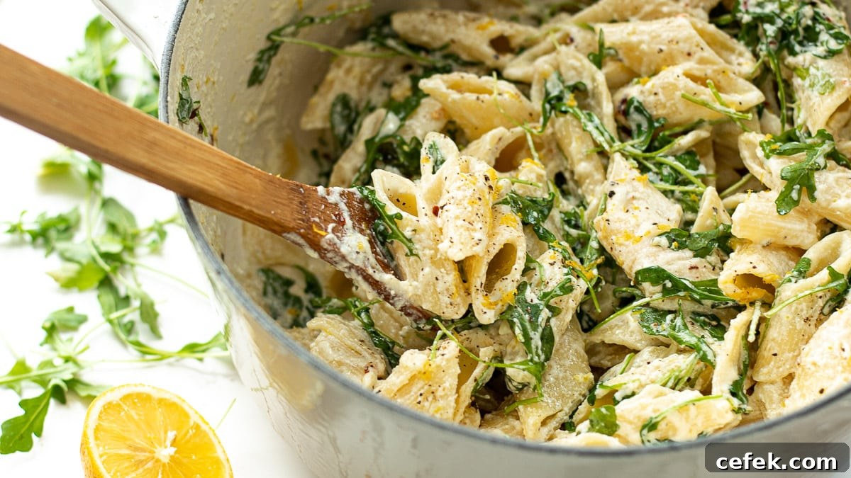 ricotta lemon pasta in a pot with a spoon