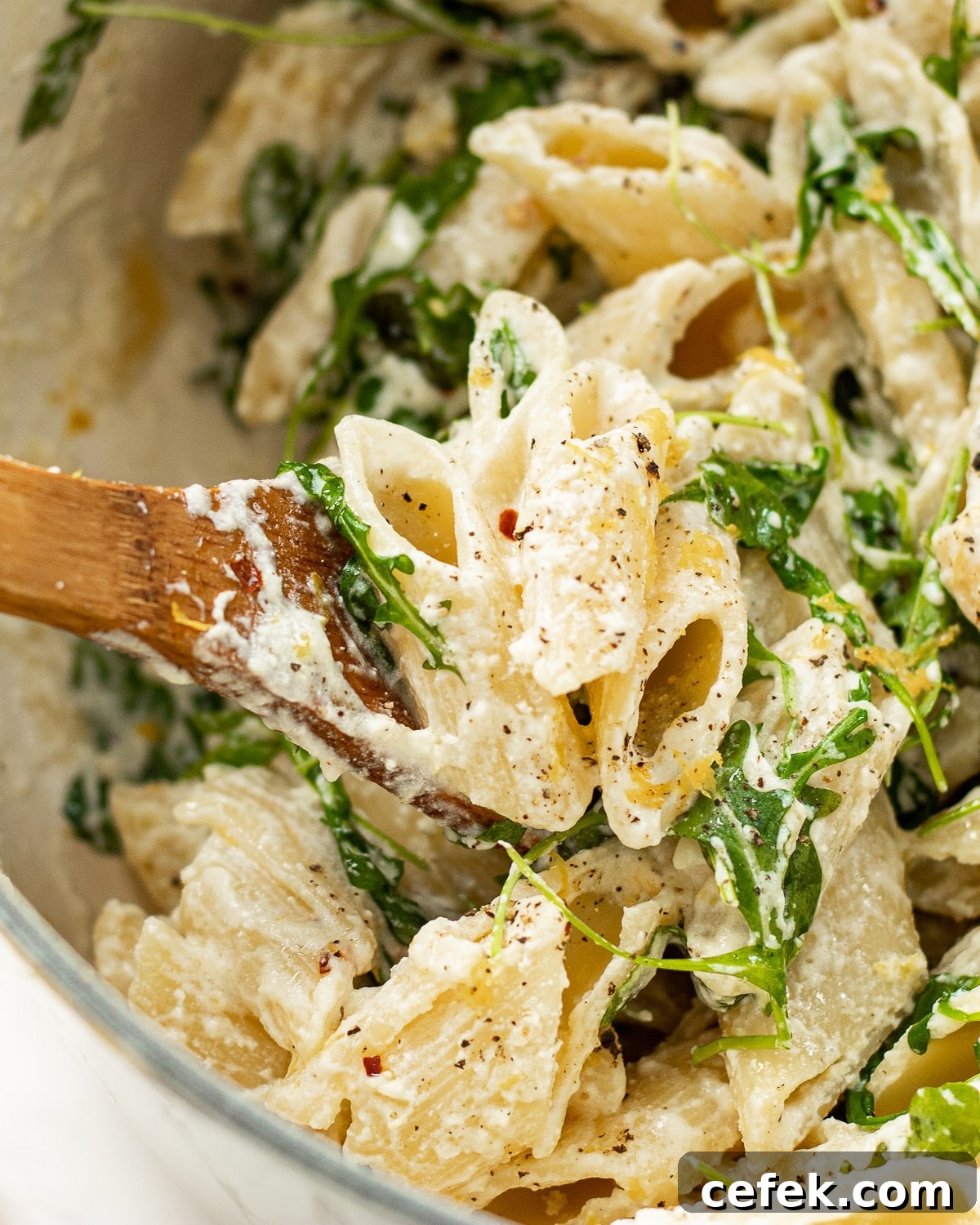 ricotta lemon pasta in a pot with a spoon