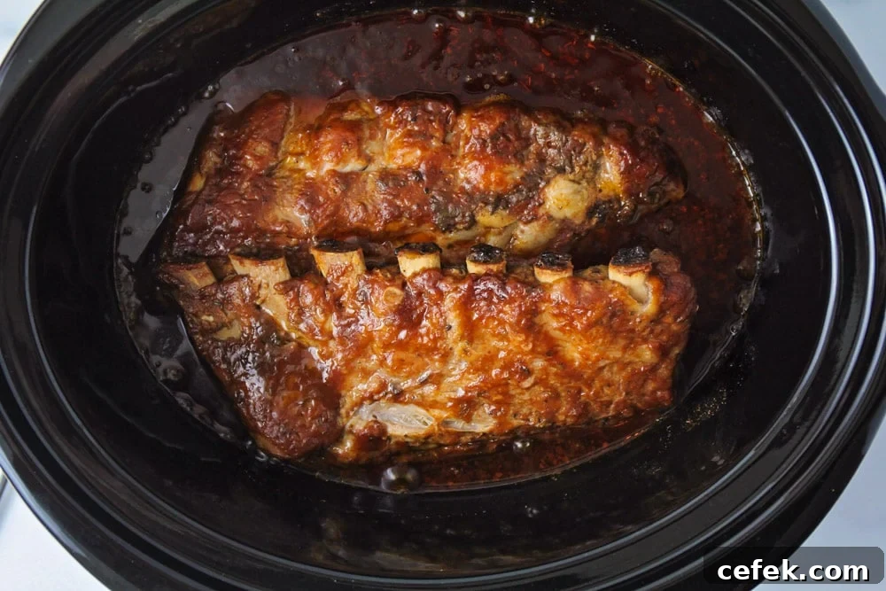Slow cooker ribs after being cooked in the slow cooker.