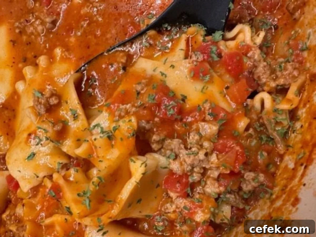 Lasagna soup topped with chopped fresh basil — all the flavor of classic lasagna in a warm, comforting bowl