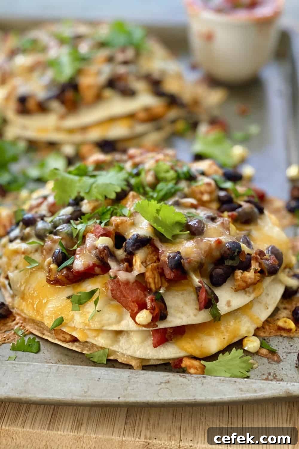 tortillas stacks with chicken, beans and corn