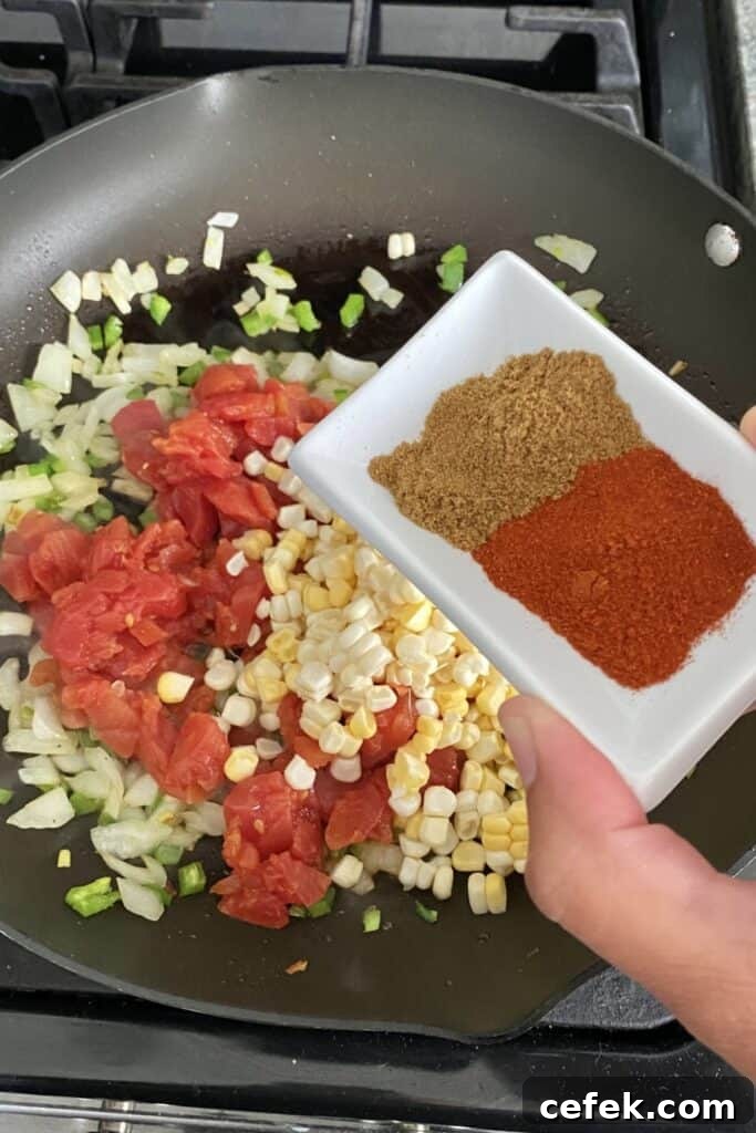 adding spices to vegetable sauté