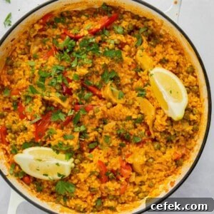 overhead shot of paella in large white pan