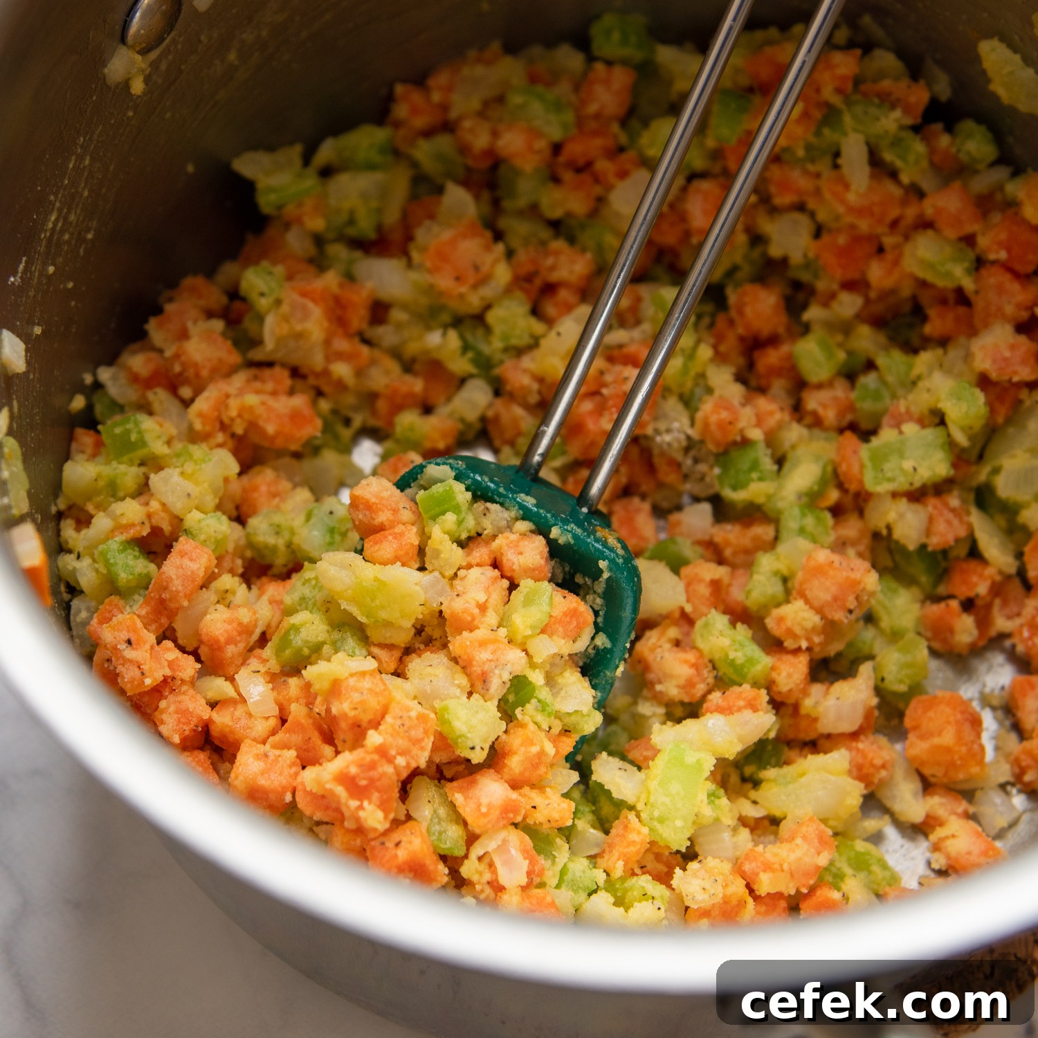 veggies in a sauce pan coated with GF flour.