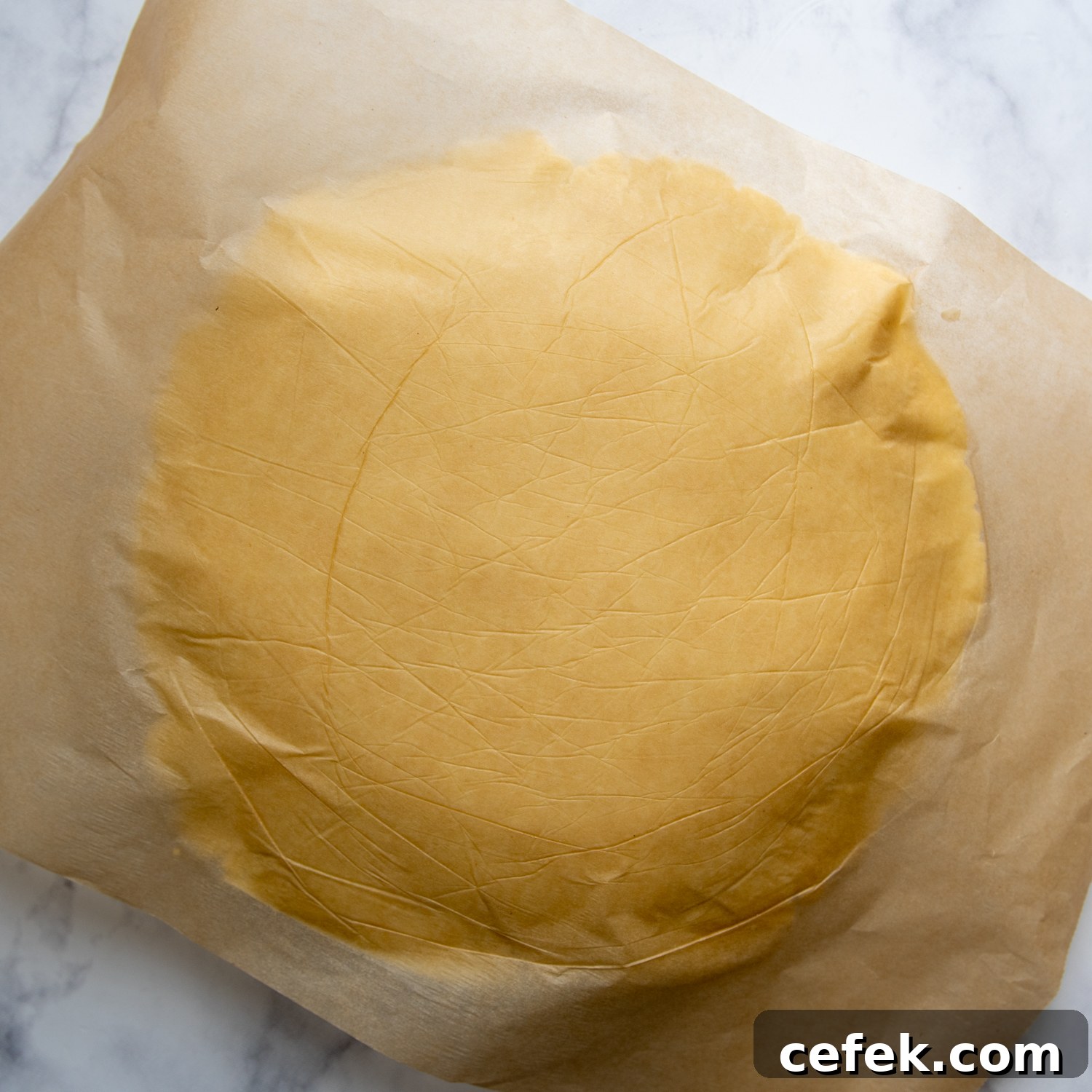 the crust placed over with a piece of parchment on top.
