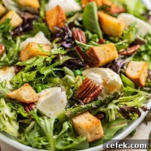 Green salad with burrata, sourdough croutons, pecans, peas and topped with citrus dressing.