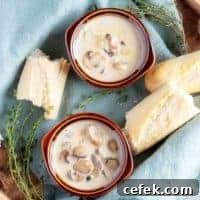 A top-down picture of the finished easy mushroom soup in brown earthenware bowls.