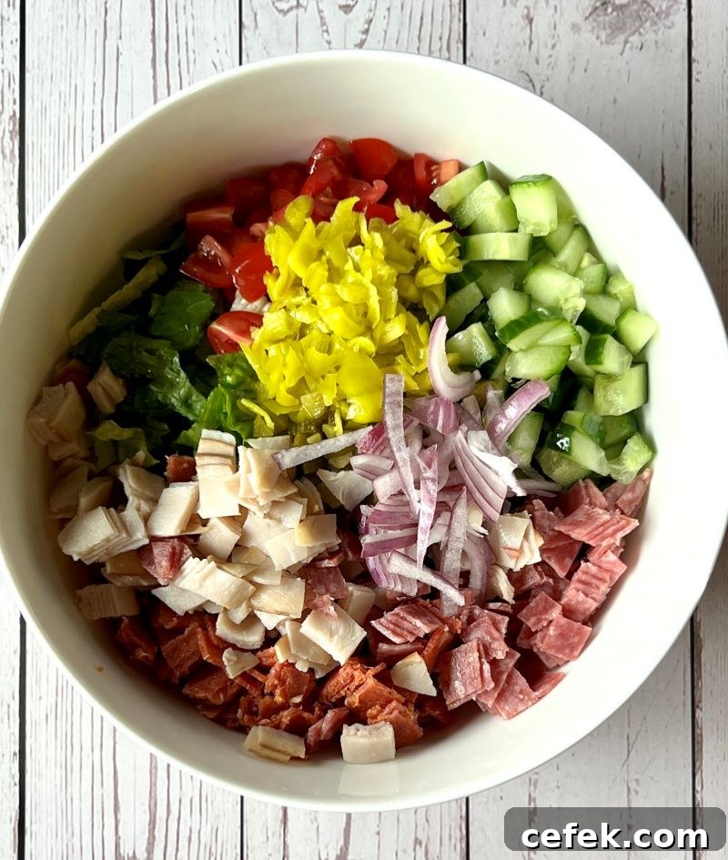 Chop salad ingredients prepared in a medium bowl 