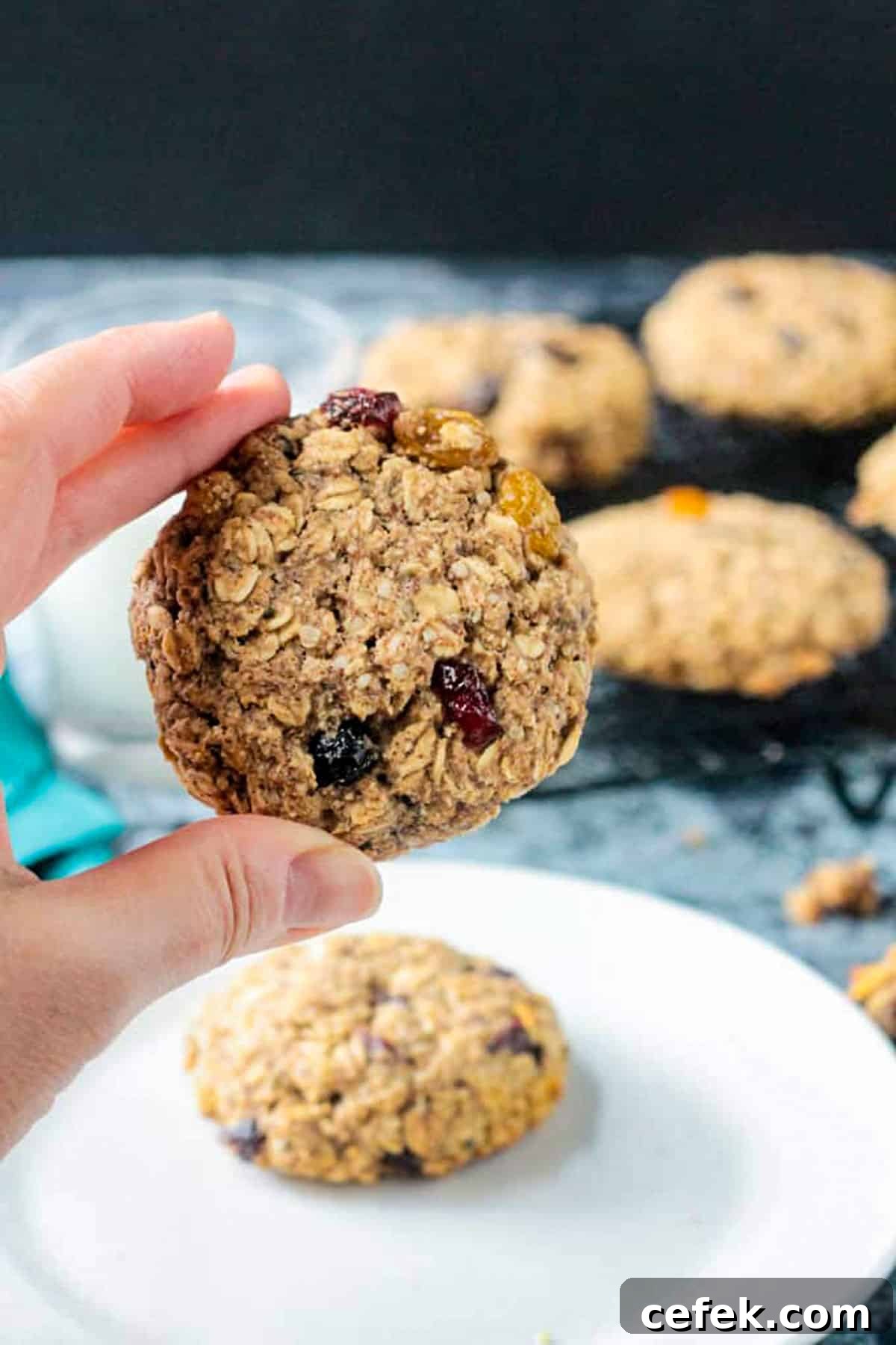 Hand holding up one baked treat.