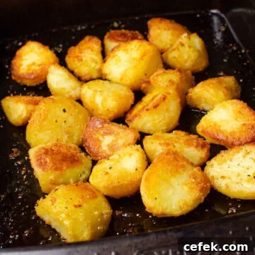 Cooked roast potatoes in a baking tray