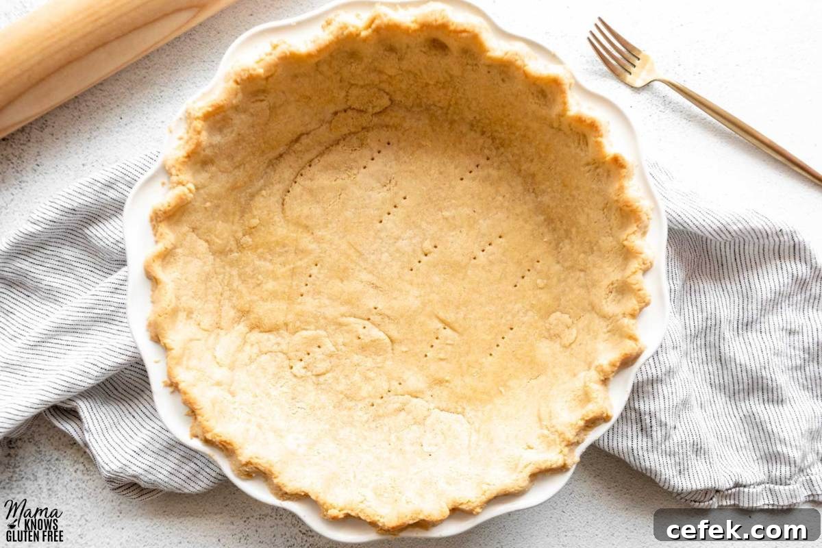 Gluten-Free Almond Flour Pie Crust baked in white pie plate.