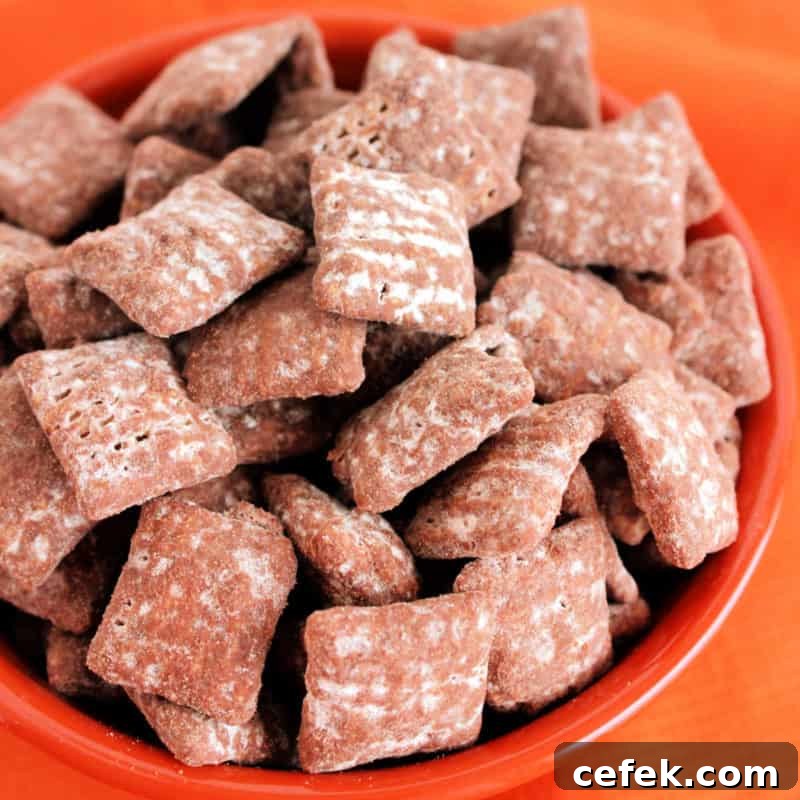 Chocolate Peanut Butter Muddy Buddies in a bowl