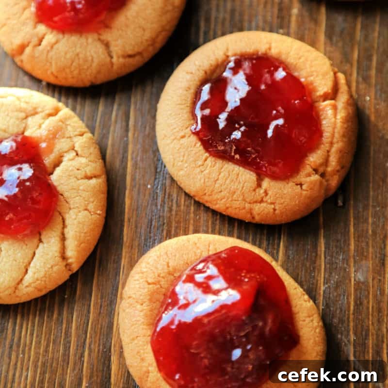 Peanut Butter and Jelly Cookies on a wood cutting board