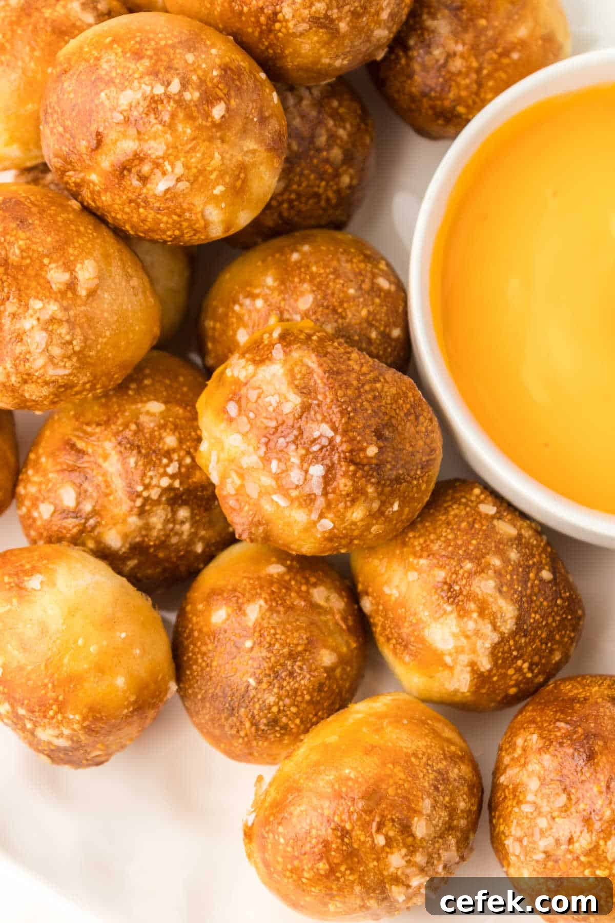 The recipe on a plate with cheese sauce.