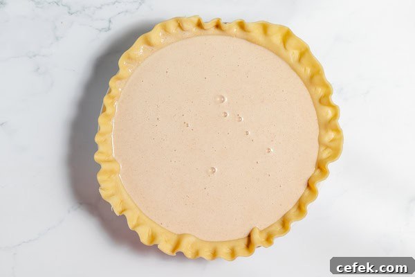 pie filling in pie shell, ready to bake