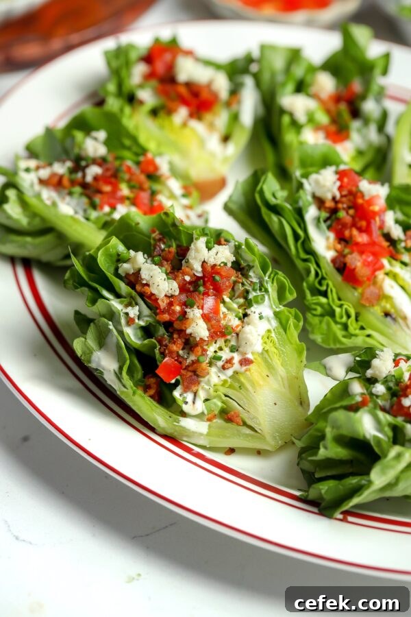 A wedge of romaine lettuce with blue cheese dressing, bacon bits, tomatoes, it has the best flavor and is handheld!