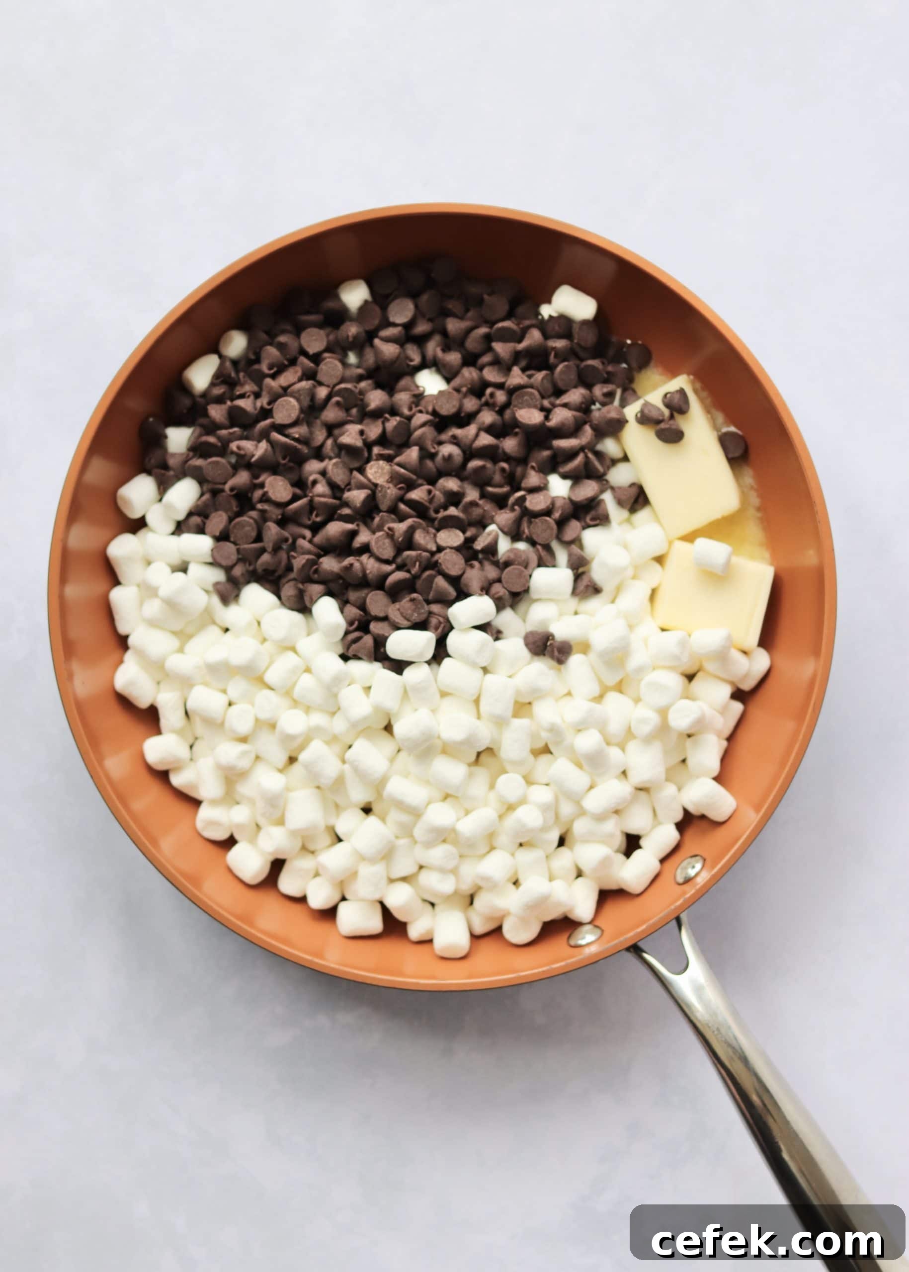 Marshmallows, chocolate chips, and butter in a nonstick skillet.