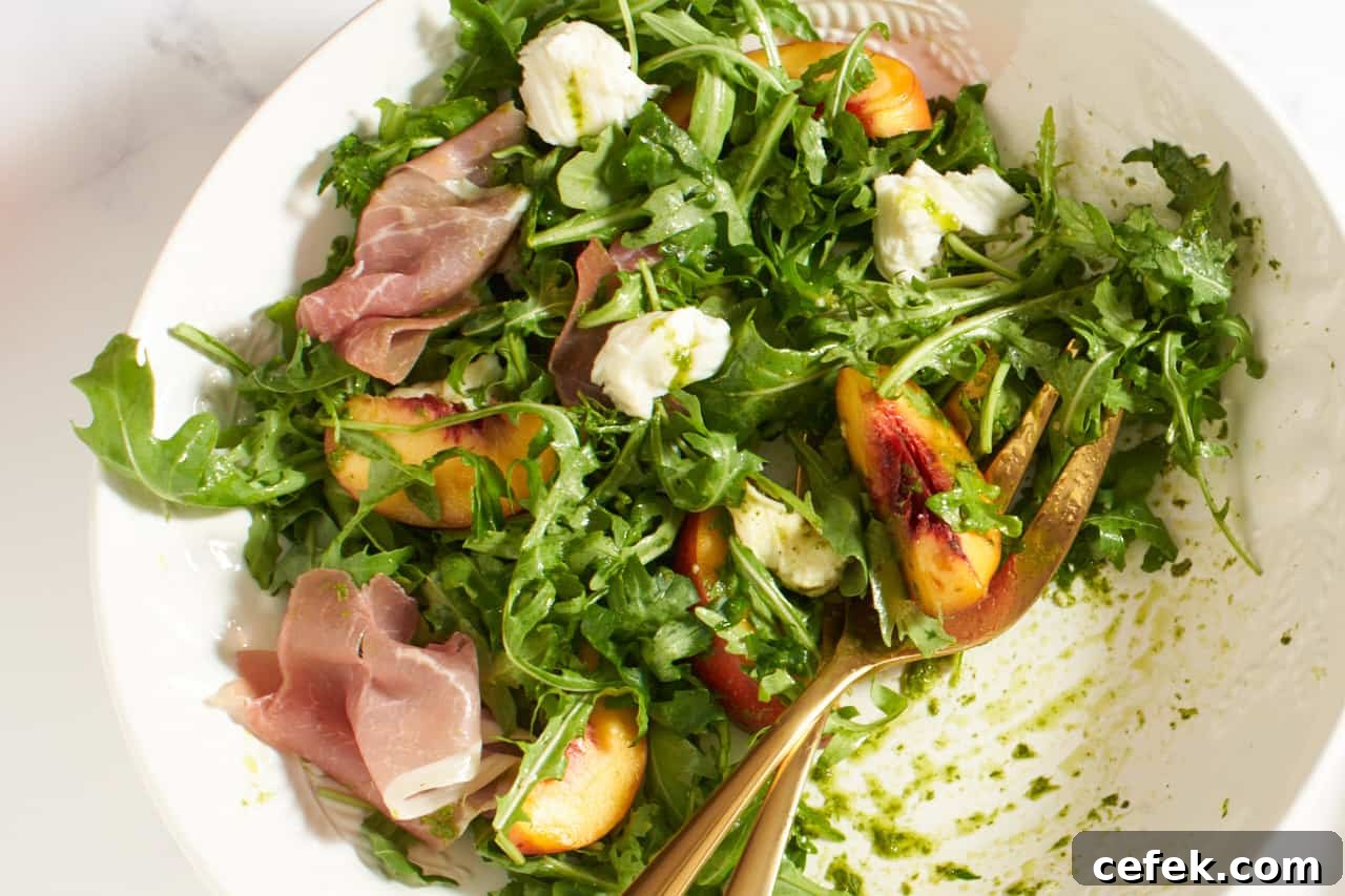 Peach salad in a white bowl.