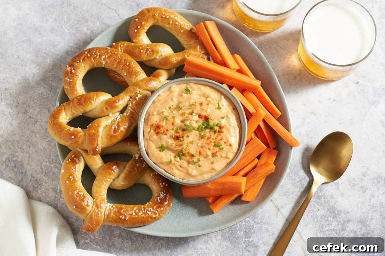 Obatzda german cheese spread in a bowl topped with paprika and chives.