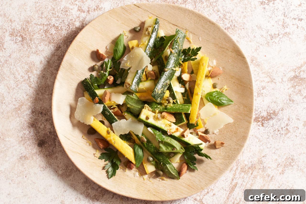 Zucchini salad on a tan plate.