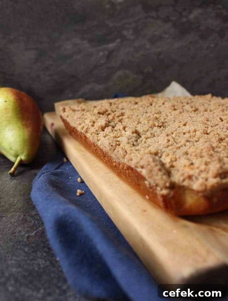 Baked cake on a wooden cutting board.