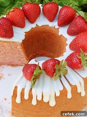 Moist strawberry pound cake on glass pedestal