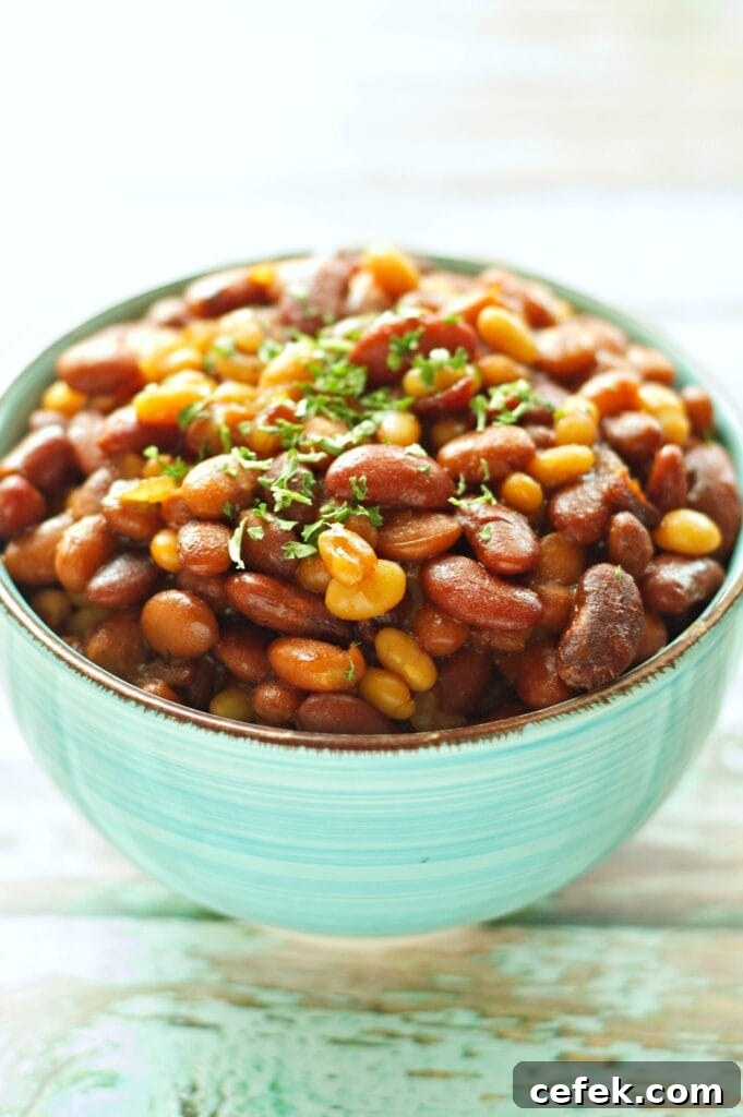 Slow Cooker Honey BBQ Baked Beans in green bowl