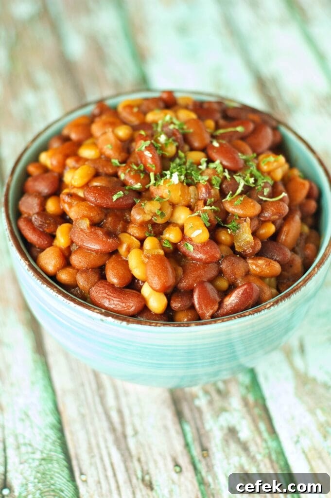 Slow Cooker Honey BBQ Baked Beans in green bowl