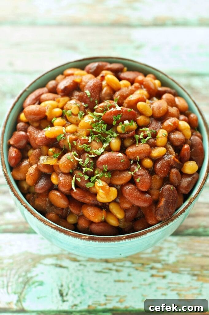 Slow Cooker Honey BBQ Baked Beans in green bowl