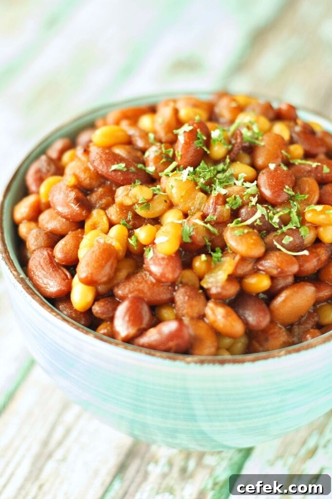 Slow Cooker Honey BBQ Baked Beans in green bowl