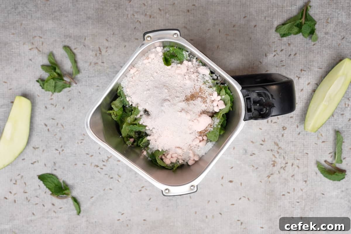 Mint leaves, sugar, cumin powder and black salt added to the blender.