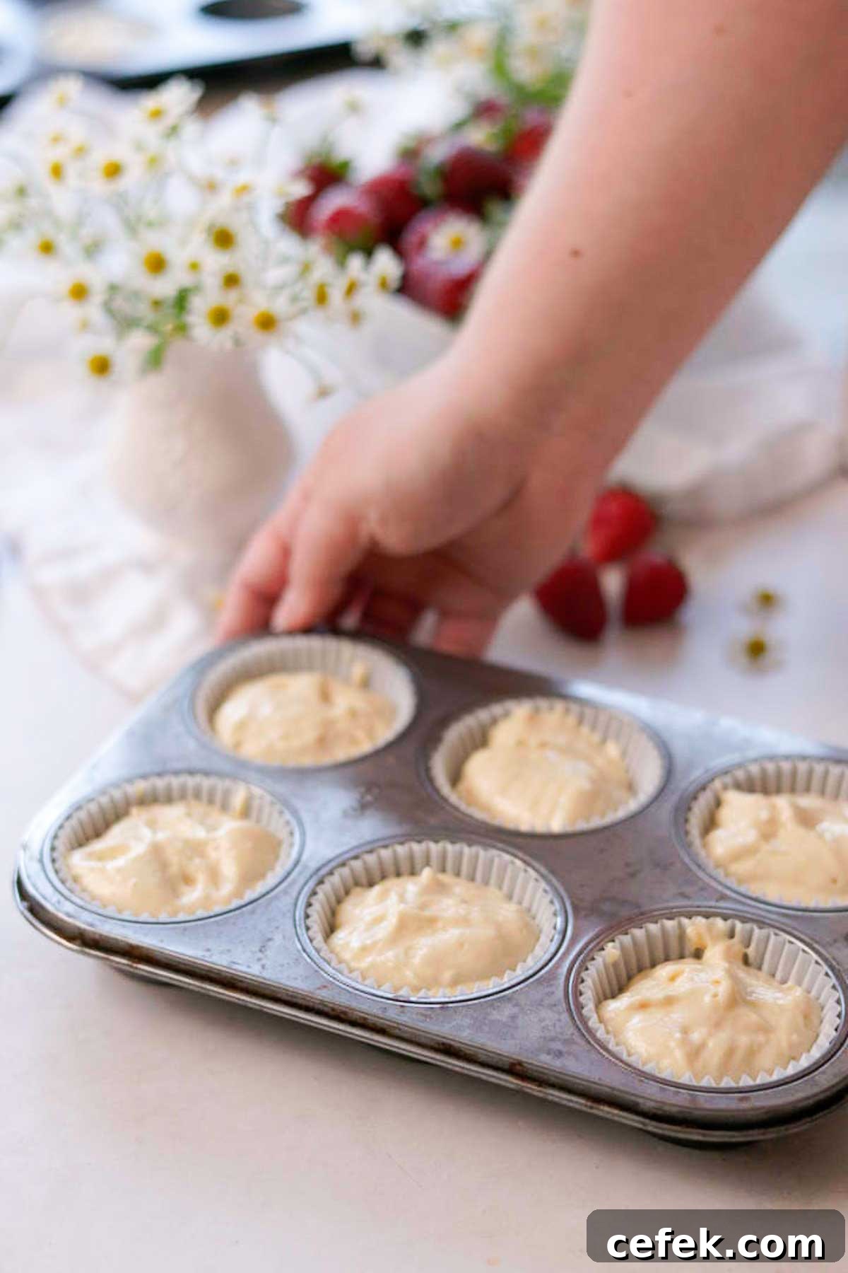 vanilla cupcake batter sitting in cupcake liners