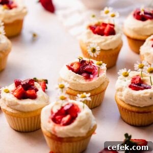 strawberry white chocolate cupcakes sitting on the table